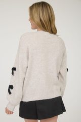BOW PATTERNED CREW SWEATER
