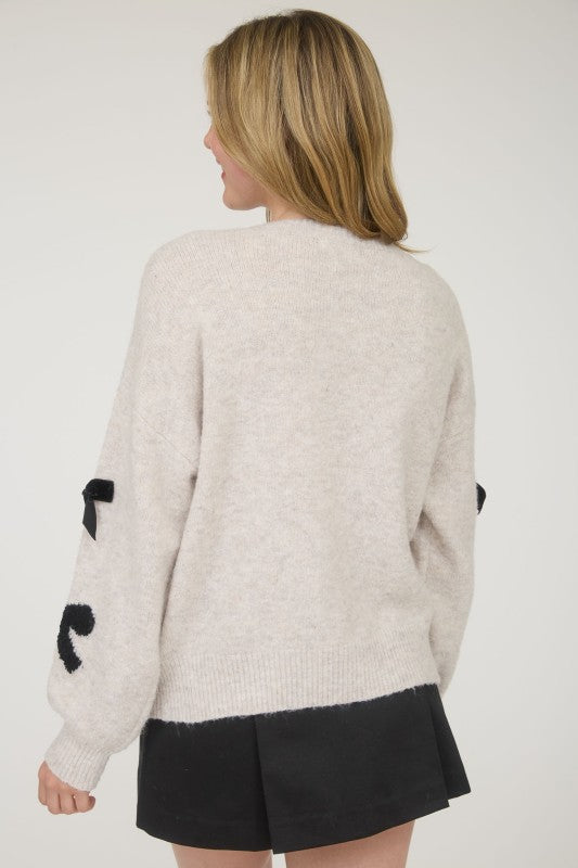 BOW PATTERNED CREW SWEATER
